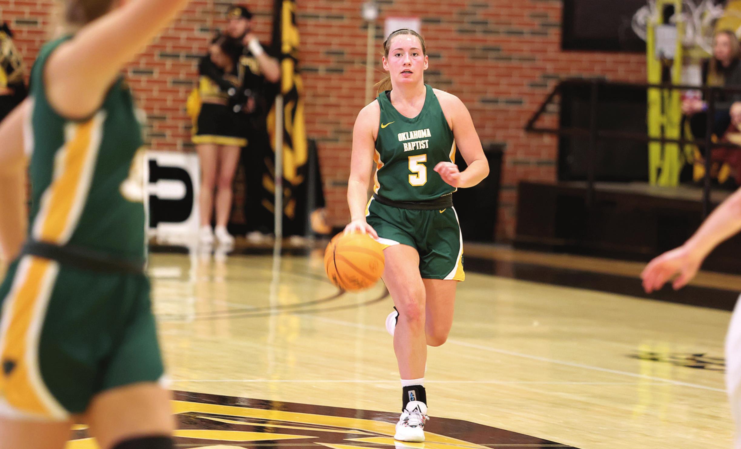 Mallory Lockhart drives down court during recent action against Cameron. Photo provided by OBU