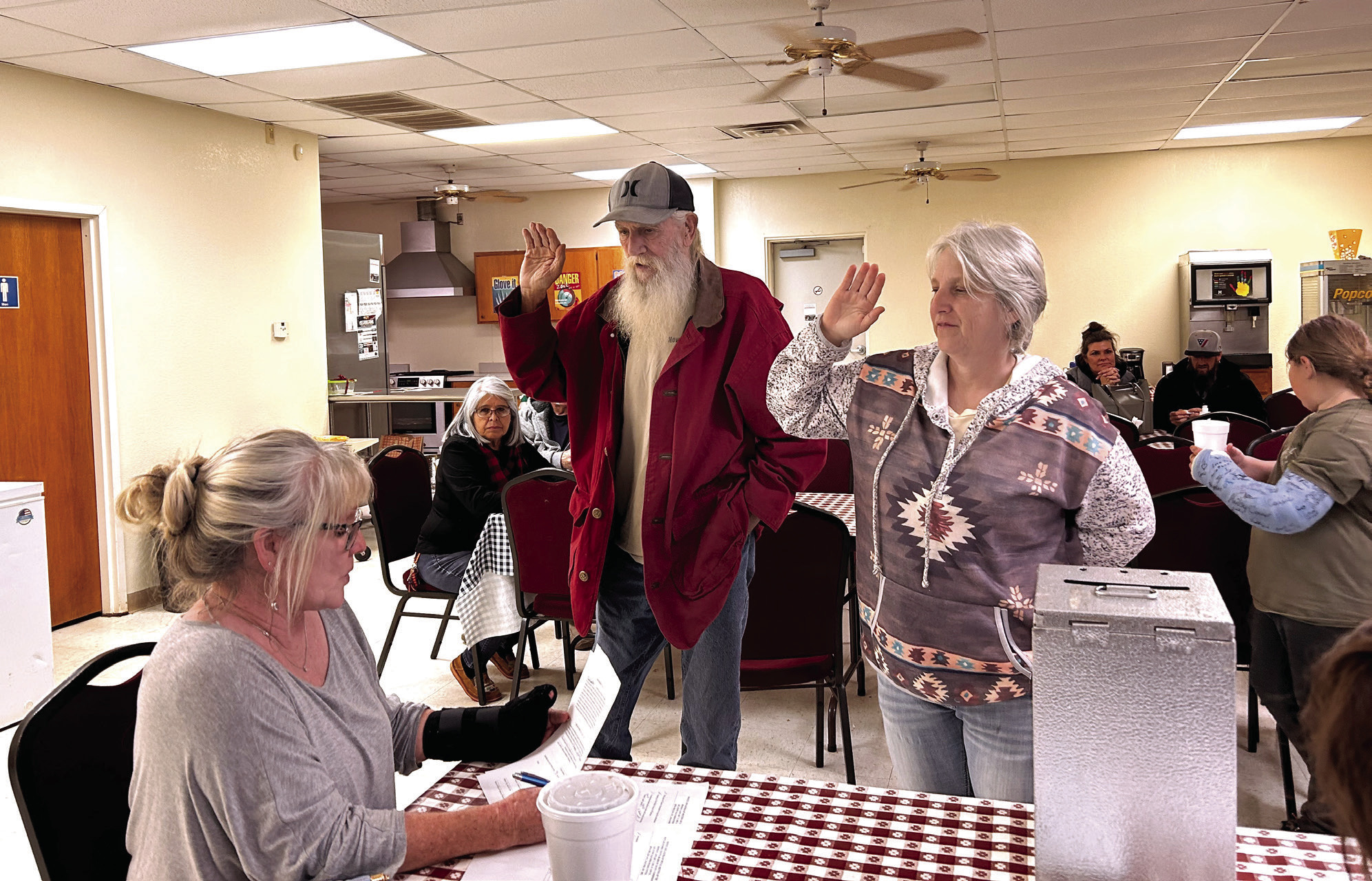 Pottawatomie County Clerk Raeshelle Flewallen swears Macomb Trustee 1 David Griffith and Trustee 2 Tami Perez into office. Perez won the coin toss for the position of Mayor. Countywide & Sun/Suzie Campbell