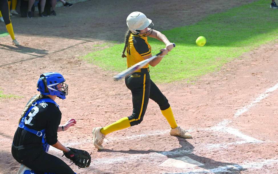 Tecumseh sophomore Madison Gray prepares to send the ball flying during the Oklahoma High School Slow Pitch Spring Showdown at Devon Park in OKC on March 27. Over two days, the Lady Savages lost to Choctaw, 4-8; then won against Little Axe, 11-1; Yukon, 9-4; and Davenport, 8-0. Photo courtesy of Kenetta Lisenbee.