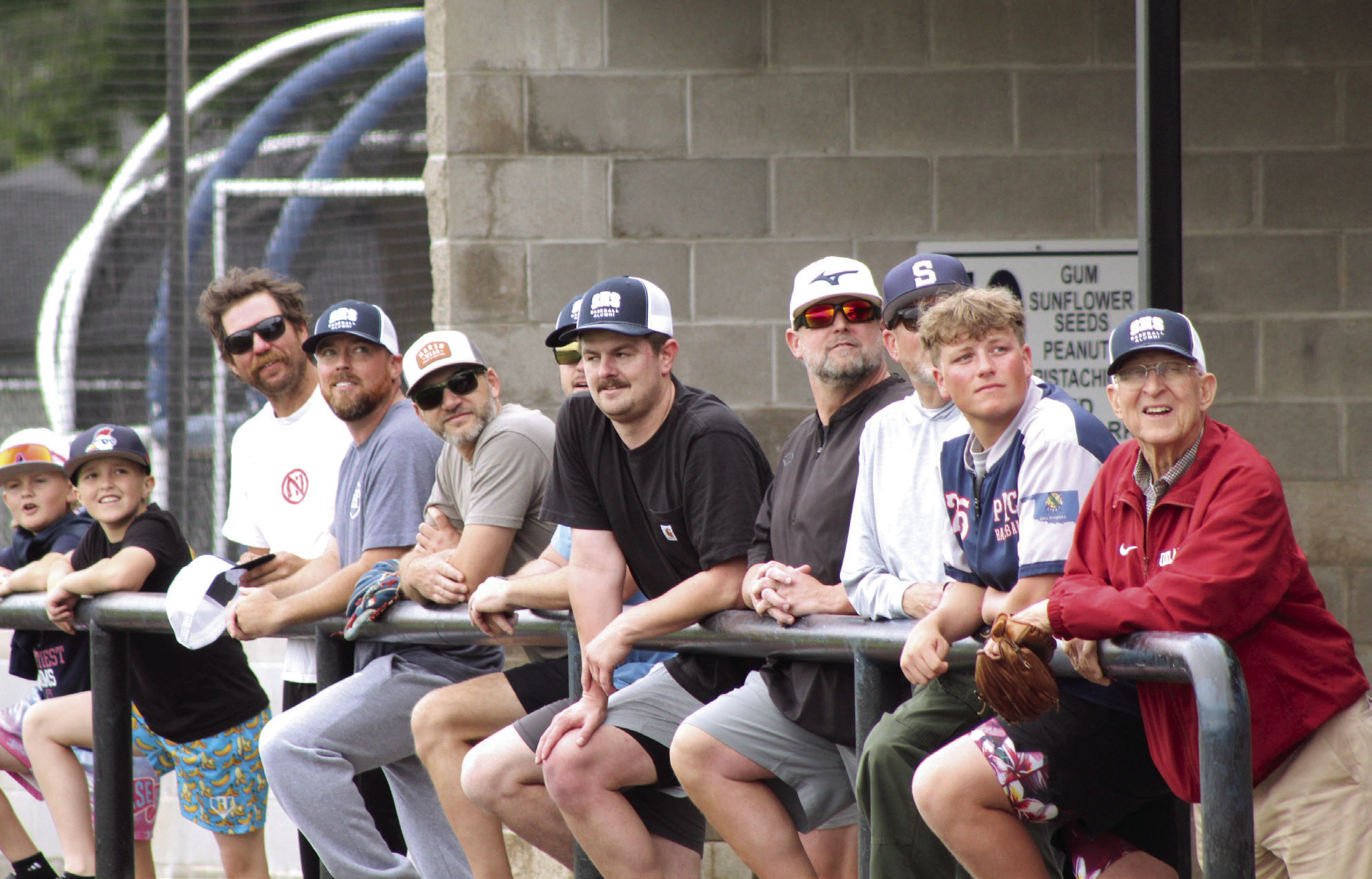 Shawnee baseball alumni watch the ball from their dugout during the SHS Alumni Game on April 25. Alumni, from left, are Tommy Smith, Bryce Holland, Jeff Cannon, Matt Bowlan, Tanner Sparks, Justin Harder, Russ Oliver, Owen Oliver and Bill Ford. Photos by Natasha Dunagan, Countywide & Sun