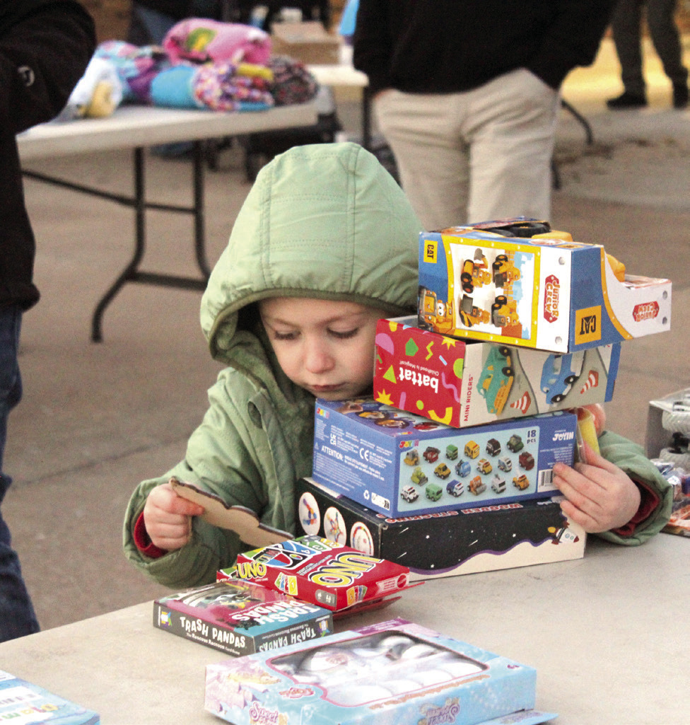 Greyson Diaz, 5, found a stack of gifts during the Fourth Annual Shawnee Police Department Toy Drive on Dec. 18.
