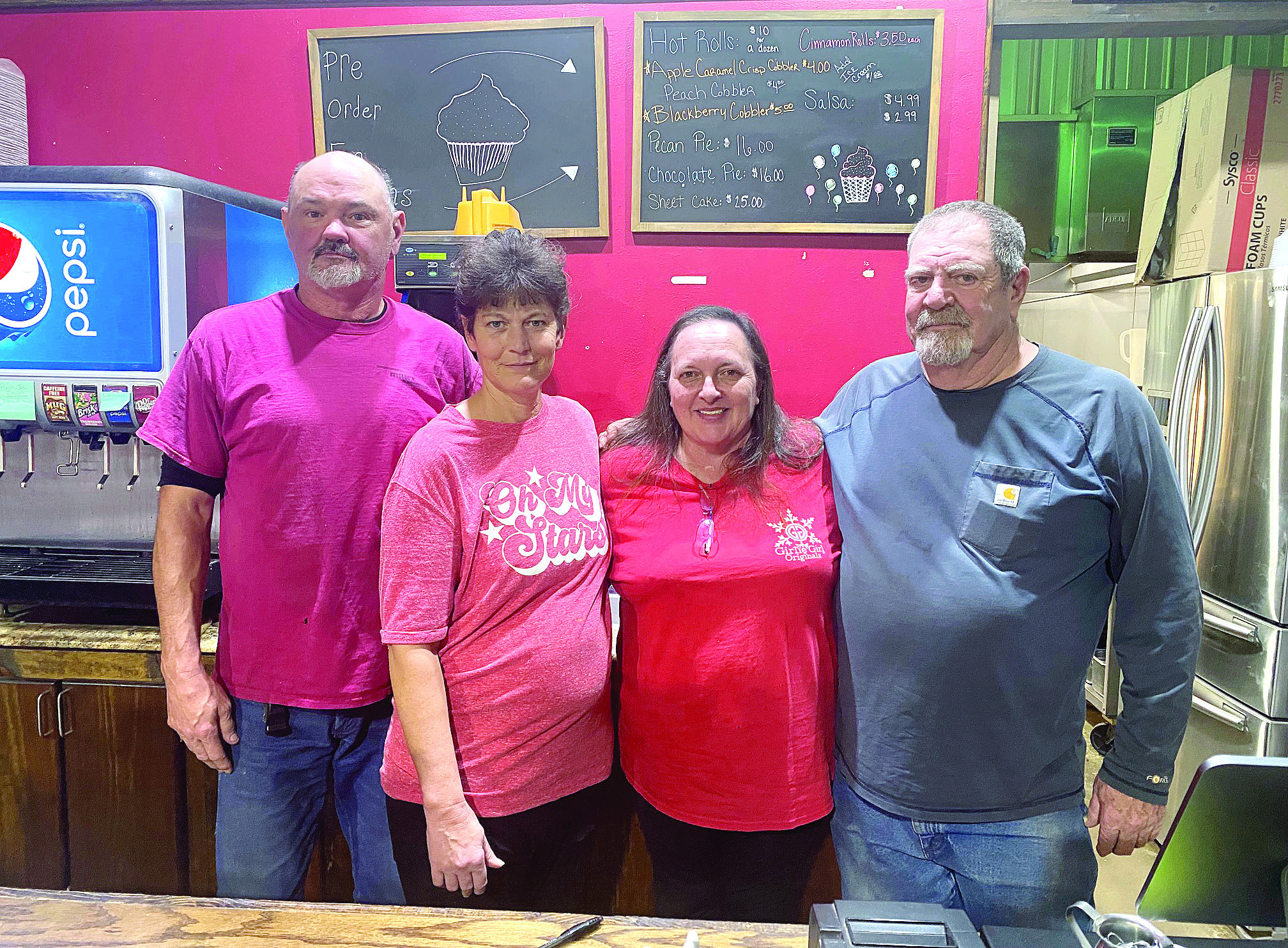 Tim and Tammy Carmichael (pictured left) stop for a photo with former owners of Cope’s Country Cafe Melissa and Pat Cope. The Carmichael’s did not want to see the business that Tammy’s family members worked so hard to build close its doors so Tammy decided to embrace the opportunity and continue the family business. Countywide & Sun/Julie Talton