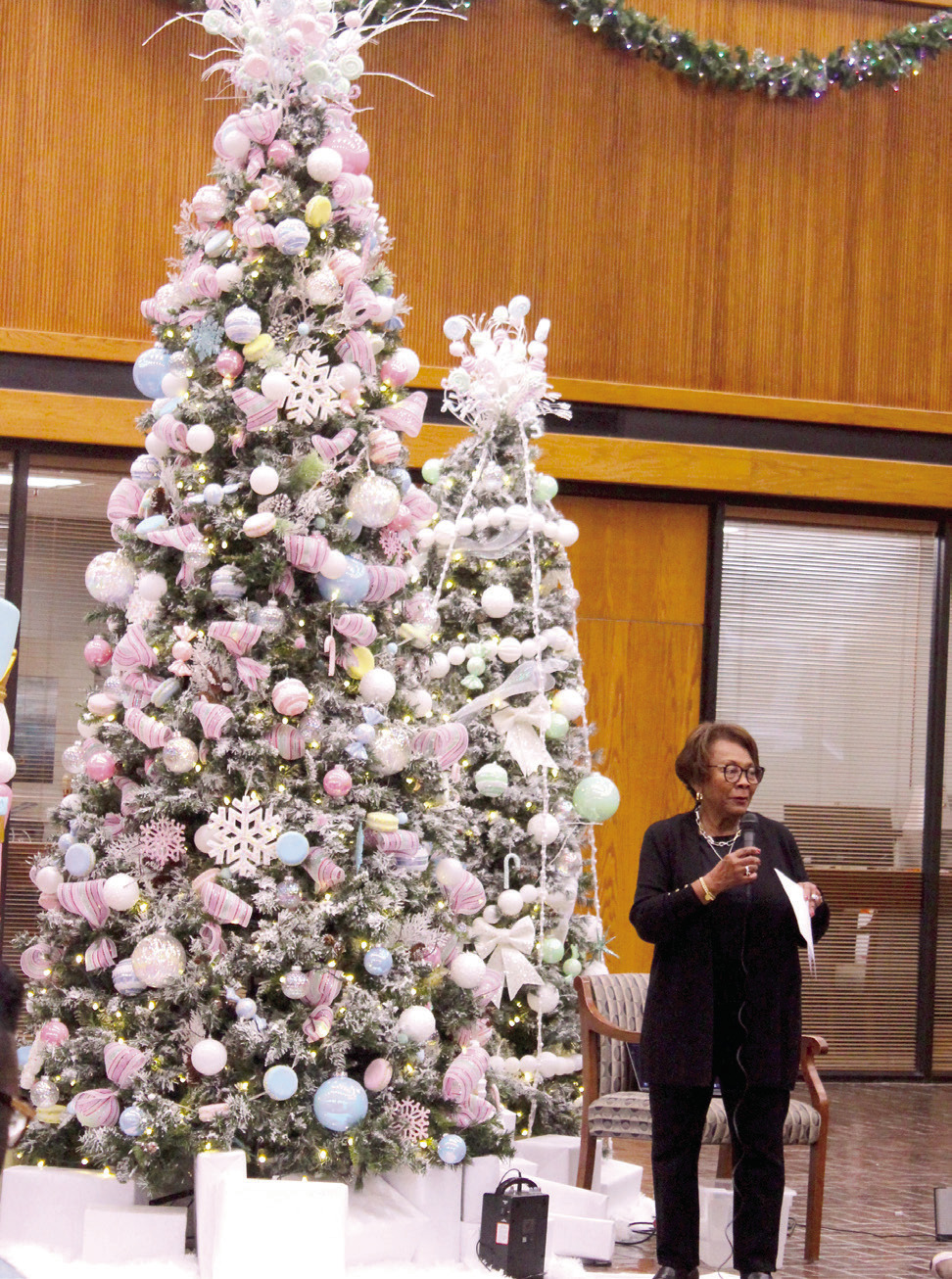Salvation Army Women's Auxiliary Angel Tree Coordinator Robbie Foxx speaks during the Angel Tree Kickoff event at Sovereign Bank in Shawnee on Nov. 20. Co-Captains Leanna and Thomas Marion also spoke during the event, and the Will Rogers Elementary Choir sang Christmas songs. In addition to the bank, there are also Angel Trees at Walmart, Lowe's, Higginbotham Bros. & Co., and Walls Bargain Center. L. Marion said there are 520 Angel Tree children who can be "adopted" this year. 