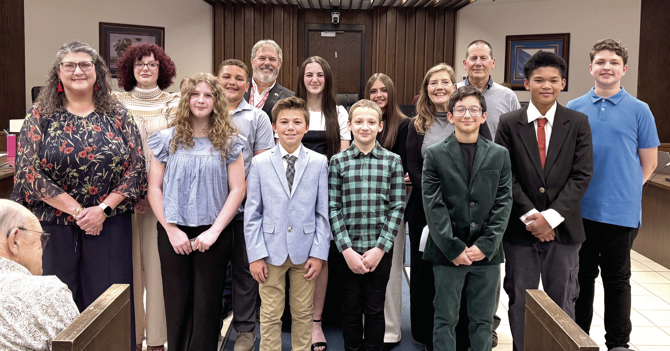 Mayor Eric Stephens passed out challenge coins to the middle school representatives of Shawnee who will be traveling to Nikaho, Japan for the Sister Cities Program. See full cutline after the story.