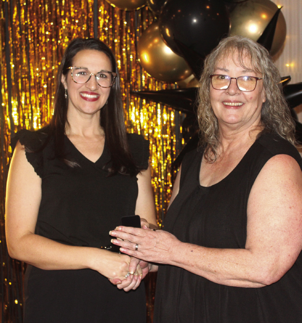 Countywide & Sun Owner and Publisher Suzie Campbell, right, presents Lacey Holt with her Pottawatomie Power Poll Top 10 lapel pin during the Awards Gala on Oct. 24. Holt tied with Michael Affentranger for 10th place. Natasha Dunagan, Countywide &amp; Sun