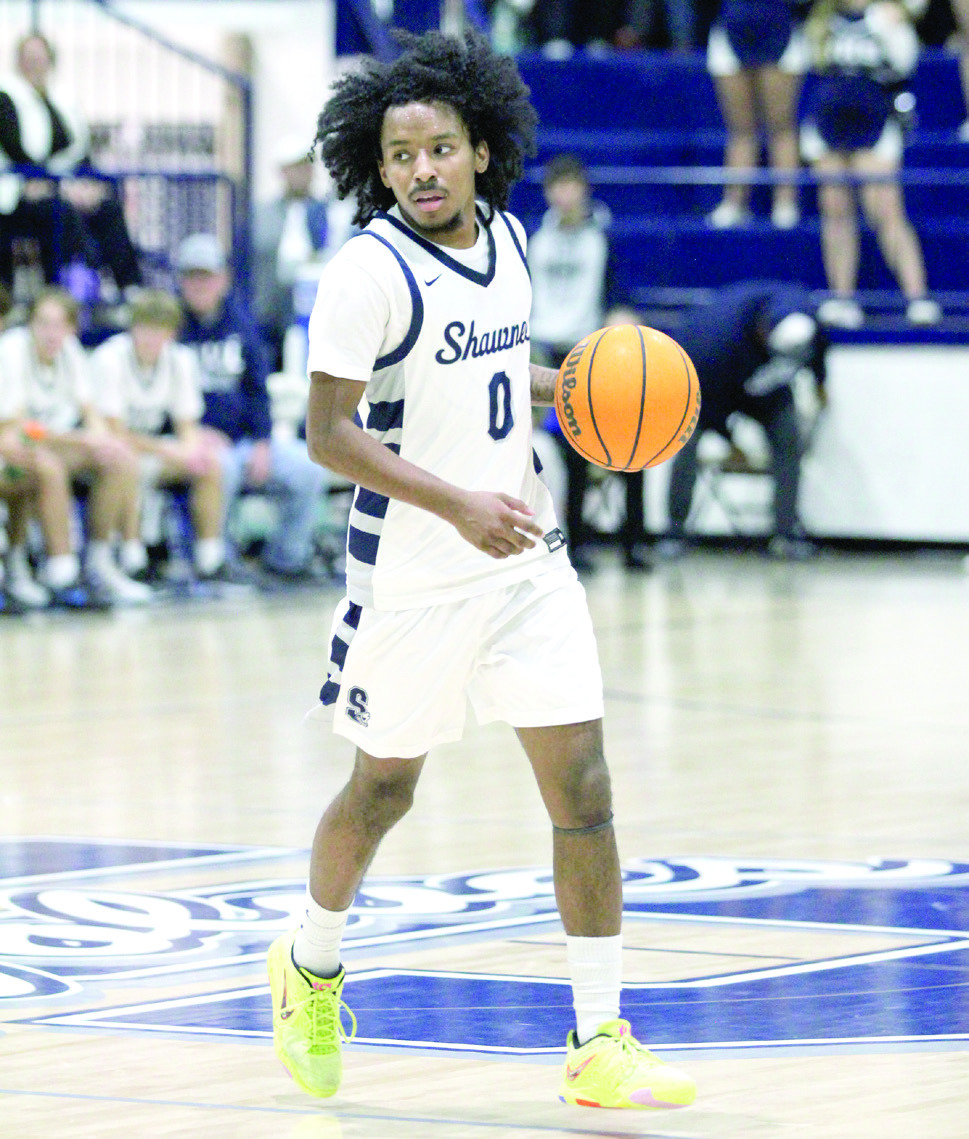Shawnee senior Daytain Patton looks to pass in the Feb. 8 home game. Patton was also recognized before the boys game for reaching 1,000 career points and given a framed picture and the game ball from the Feb. 4 Guthrie away game. Countywide &amp; Sun/Natasha Dunagan