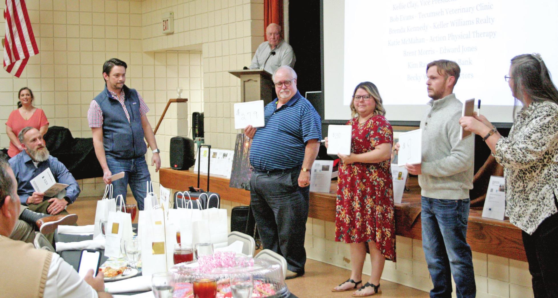 Tecumseh Chamber of Commerce Past Board President Luke Fugate (left) oversees a game of “Price is Right” during the Tecumseh Chamber of Commerce’s 21st Annual Auction. Countywide &amp; Sun/Kendra Johnson