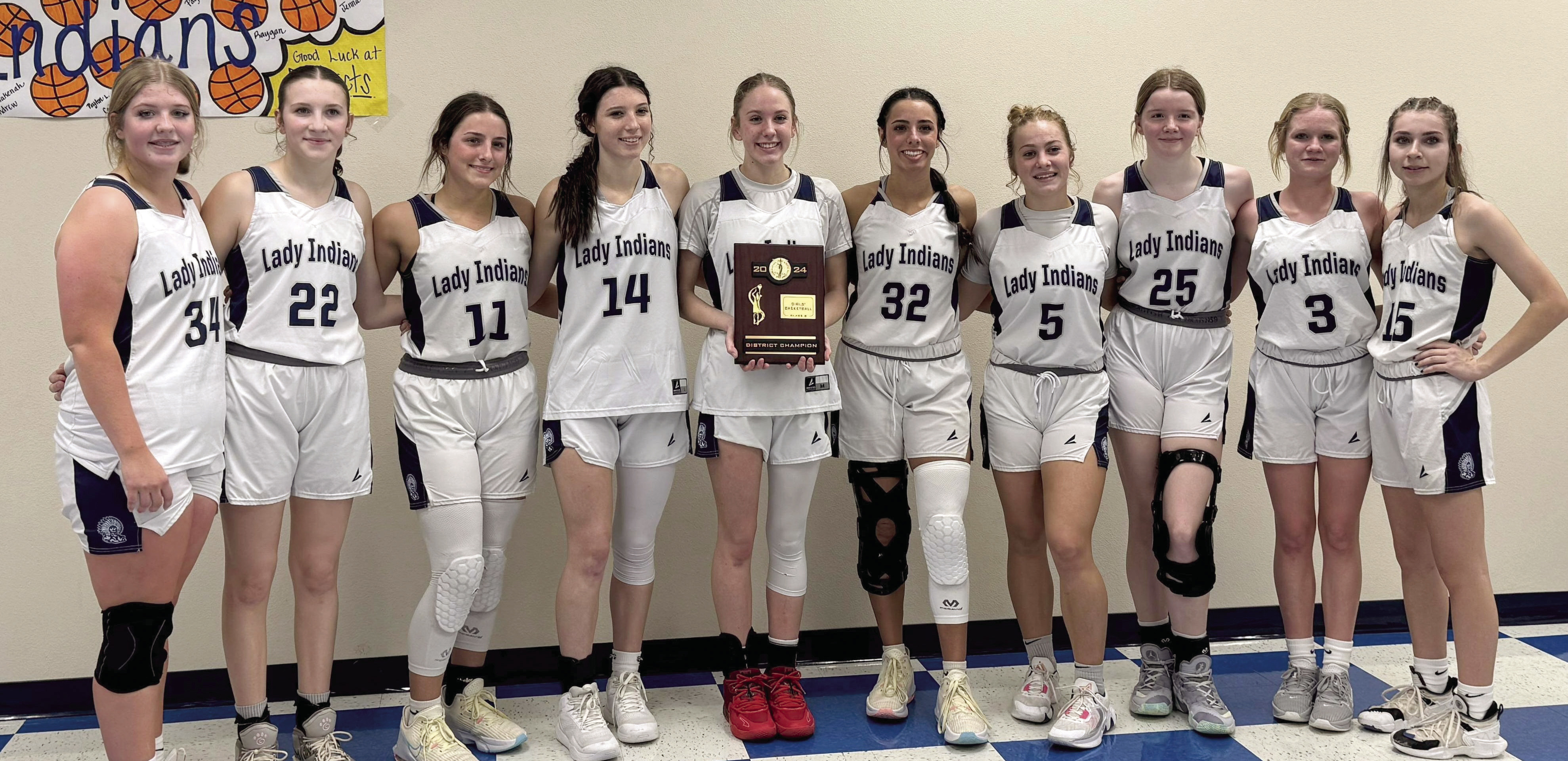 The Asher Lady Indians pose with their District Championship plaque after beating Legacy Christian 45-14 in the finals on Saturday, Feb. 10. Photo provided