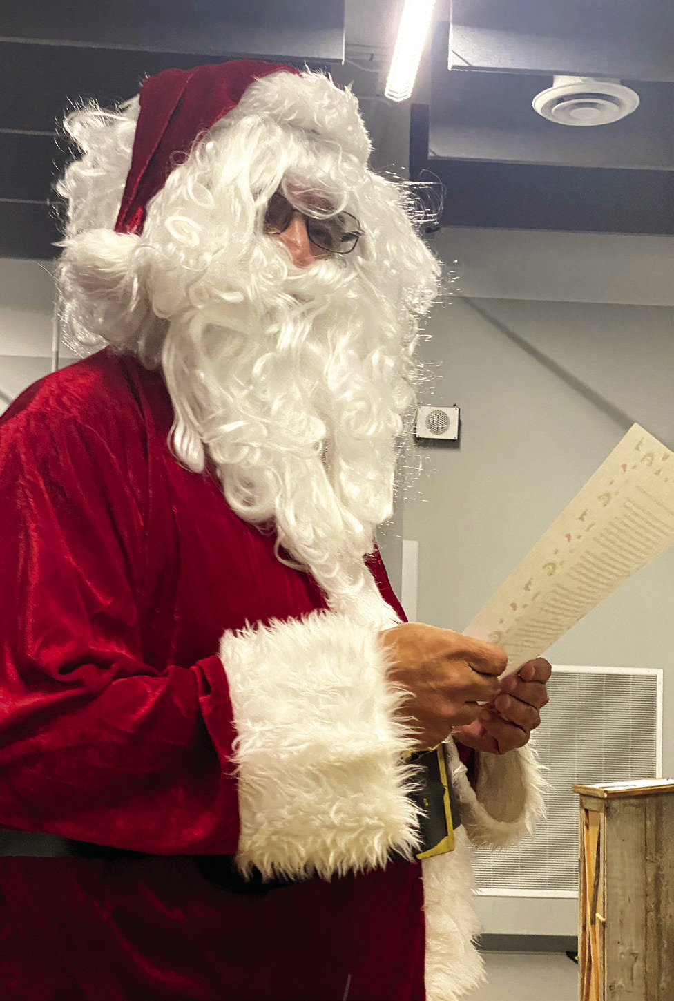 Victor Cope, dressed as Santa Claus this month, made his continuing plea the board to remove the “Savage” name. This month, he read about a dark chapter at Christmastime. Countywide &amp; Sun/Julie Talton