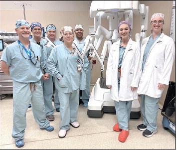 Robot Team in Shawnee: Dr. Amanda Schovanec and Dr. Danielle Manship (at right in lab coats) and the robotic surgical team at SSM Health St. Anthony Hospital – Shawnee. Photo provided by SSM