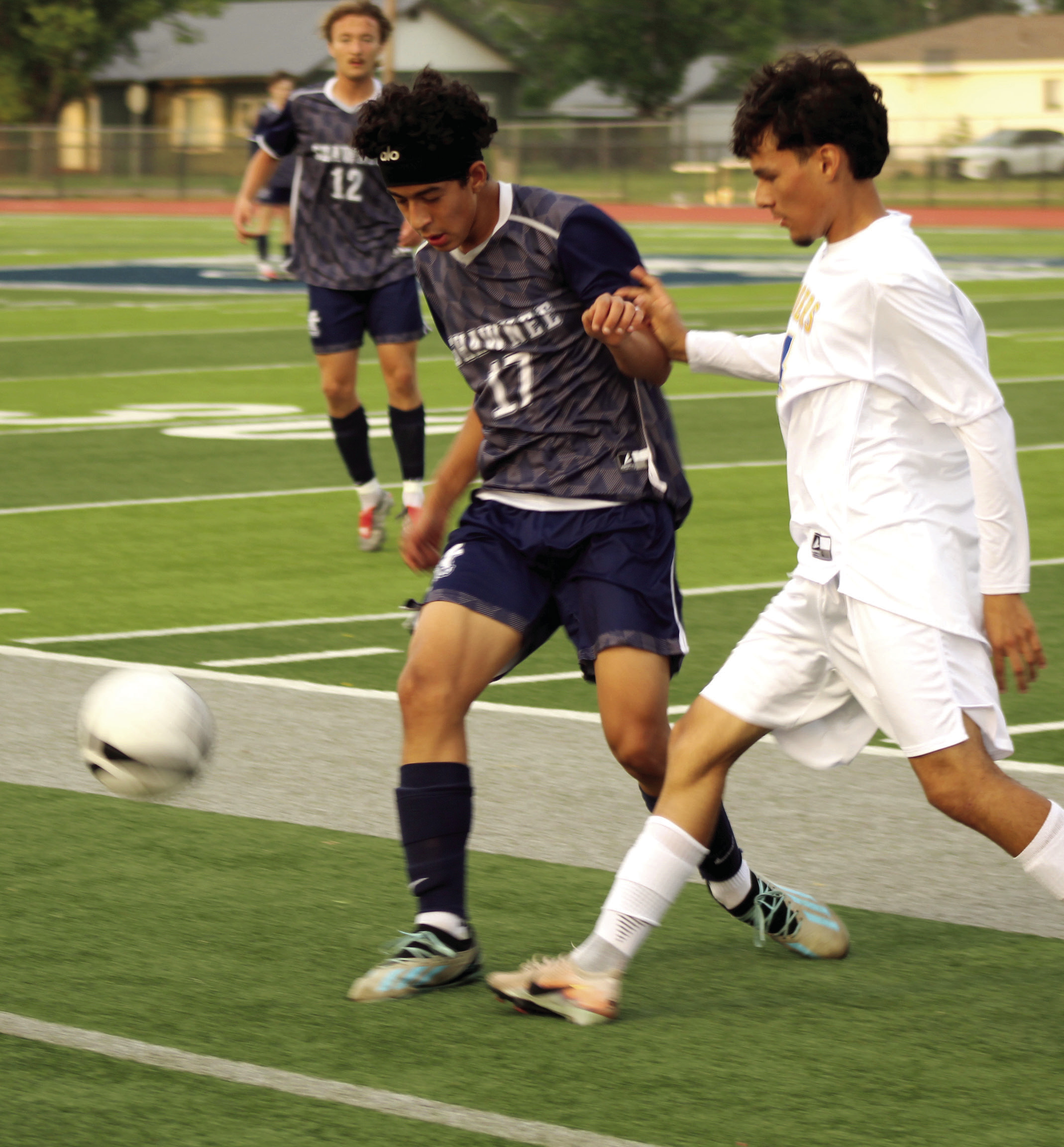 Shawnee's Derek Lopez (#17) jockeys for possession of the ball at the April 17 home game against Will Rogers. The Wolves won 4-3. Photos by Natasha Dunagan, Countywide & Sun