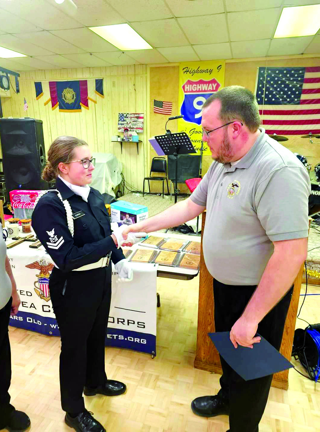 Training Ship Oklahoma Commanding Officer Alex Murray presents his daughter Petty Officer Diana Murray with the Leaguer of the Year Award during the U.S. Naval Sea Cadet Awards, held at the Tecumseh American Legion Post #260 on Sunday, Dec. 17. Photo provided by Donna Snodgrass.