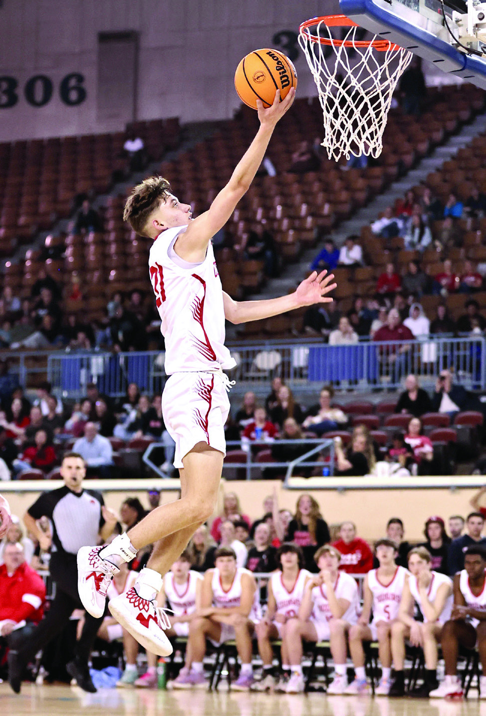 NRCs Jordan Coody soars to the rim for two in State Quarter-Final action Mar. 8. Photo courtesy of Gowin Photography