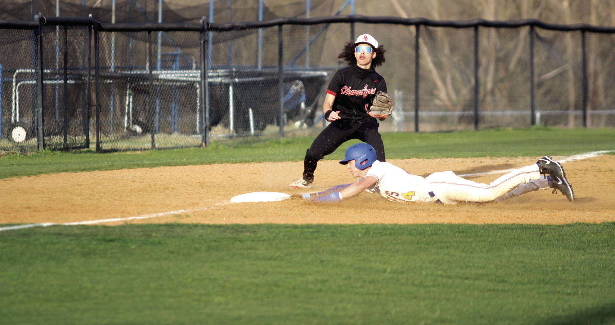 During the second game with Okmulgee on March 24, Bethel senior Roger Brooks dives to steal third base and is safe. The Wildcats won both games in the double header, 16-2 and 16-5. Natasha Dunagan, Countywide & Sun