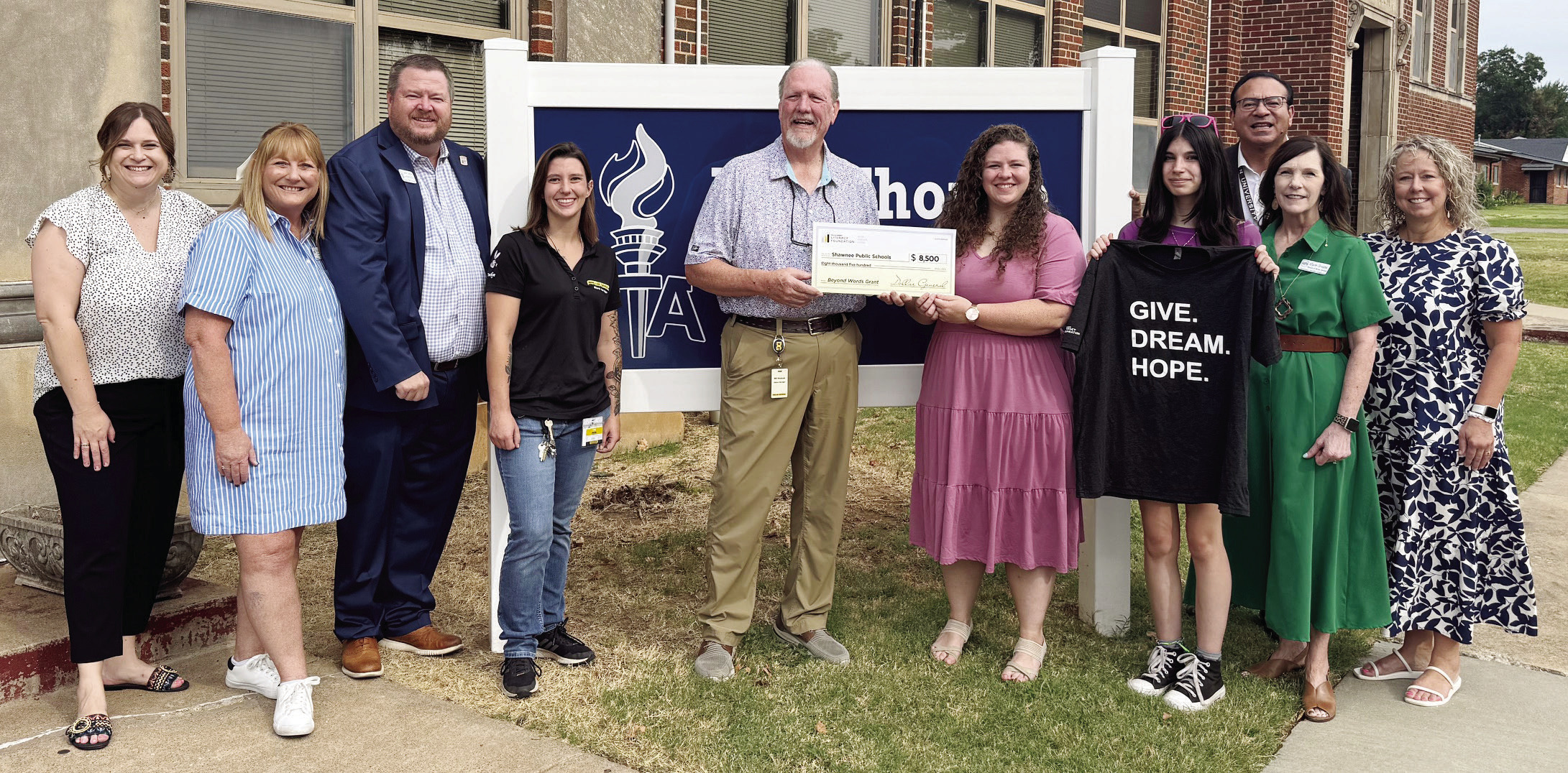 Shawnee Public Schools Administration is pictured with Jim Thorpe Academy Principal Hannah Holland, Dollar General District Manager Bill Dockum, and local manager Lexi. Photo Provided