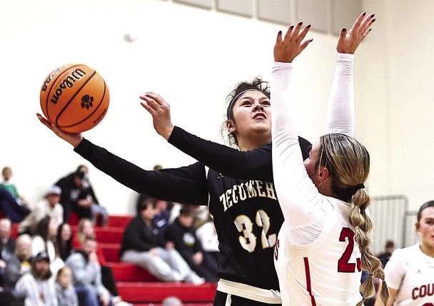 North Rock Creek's Jaxtyn Ratcliff puts the pressure on Tecumseh's Sadie Winlock in the game against Tecumseh. NRC won the match-up 57-32 improving to 6-0. Photo provided by Gowin Photography