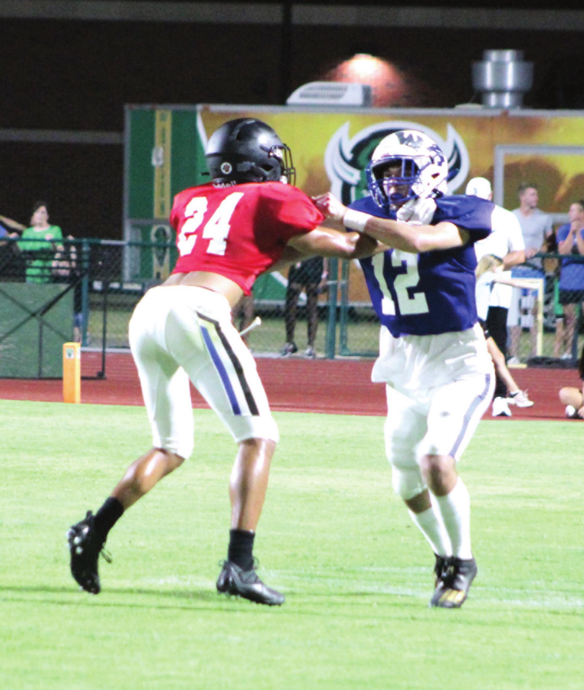 Bethel graduate and wide receiver John Gordon blocks a player on the West Team during the All-State Football game on July 29 at OBU’s Crain Family Stadium. Countywide &amp; Sun/Natasha Dunagan