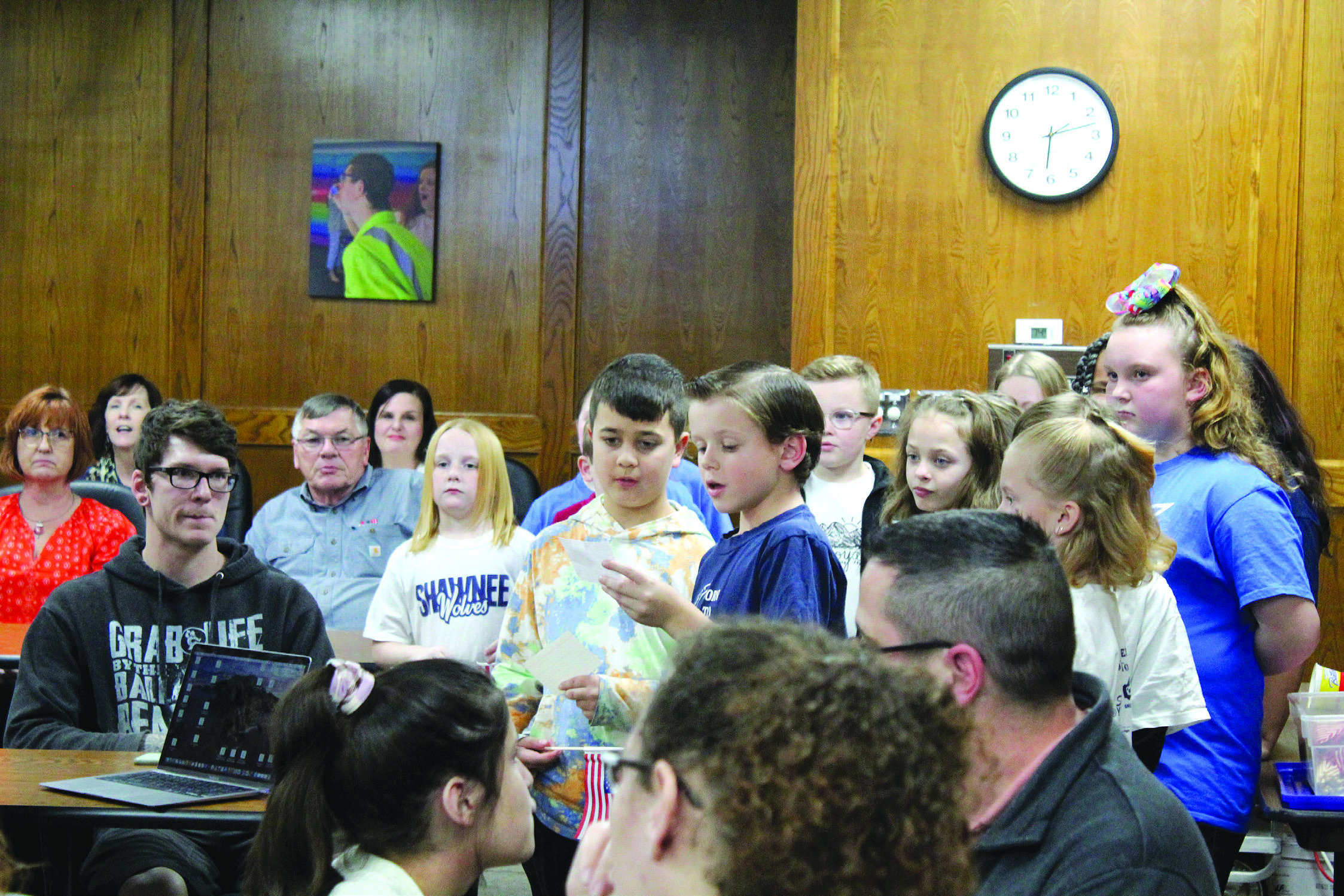 Joshua Ruiz and Carson Hutchcraft, two Sequoyah Elementary third-grade students, tell about the song “You’re a Grand Old Flag” before singing it at the Jan. 9 Shawnee Board of Education meeting. They were led by Music Teacher Jana Stelzer. In recognition of Sequoyah Elementary, Principal Kim Paxson introduced fourth-grader Reece Turner who led the flag salute. Countywide &amp; Sun/Natasha Dunagan