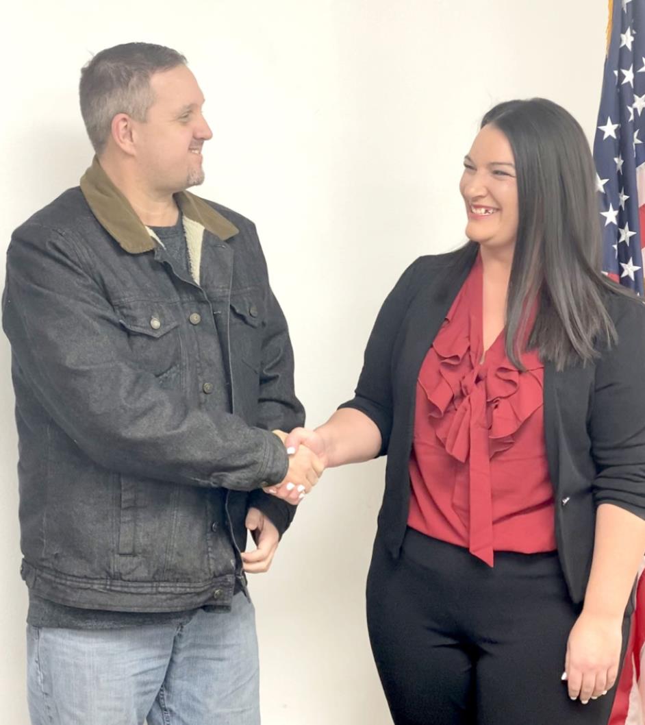 DA Allan Grubb (left) welcomes Kayxandra Koonce as the new Executive Director of the Child Advocacy Center at the Pottawatomie County Commissioners meeting Monday, Dec. 20, 2021. Koonce will officially begin in her new roll on Monday, Jan. 3, 2022.