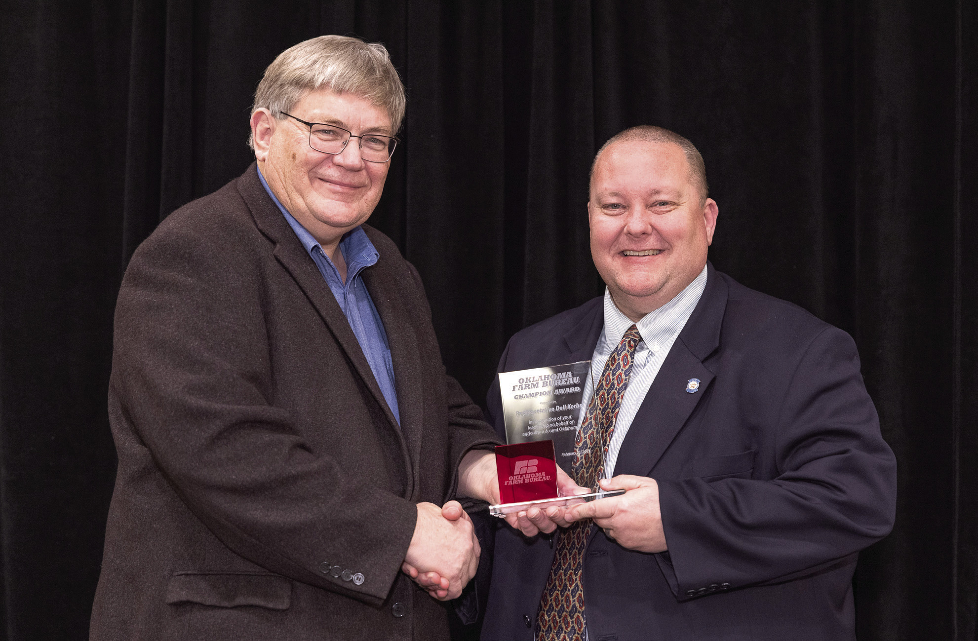 Oklahoma Farm Bureau President Rodd Moesel presents Rep. Dell Kerbs with an Oklahoma Farm Bureau Champion Award at the 2023 OKFB Leadership Conference Feb. 21. Photo provided