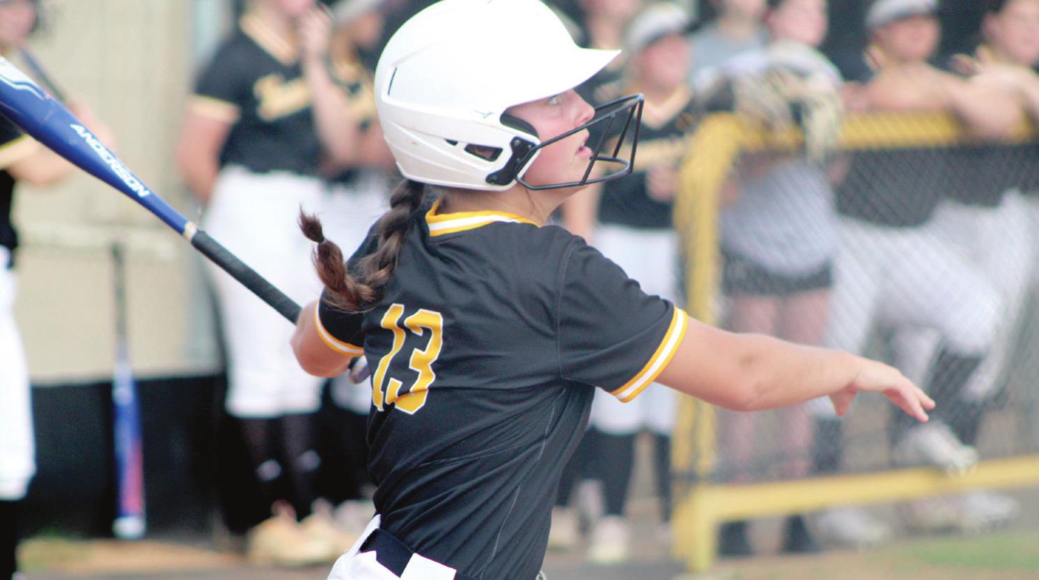 Tecumseh junior Taylor Gage hits a triple in the fourth inning of the Class 5A District slowpitch game against Bethel on April 21 at Tecumseh. During the double header, the Lady Savages won both games, 10-0, to become the district champions. Countywide &amp; Sun/Natasha Dunagan