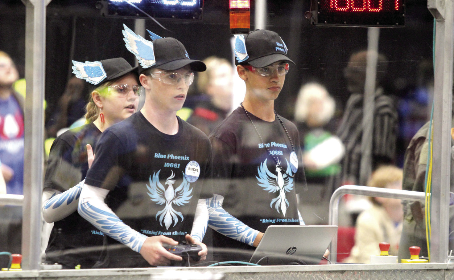 Grove School eighth-graders Emma Knight, Conner Vorndran and Daniel Bowlan watch over and control their robot, Sapphira, during the Oklahoma Regionals FIRST Robotics Competition, held at FireLake Arena on April 5. They are members of the new community robotics team called Blue Phoenix, which is housed at OBU and led by Lori Farris, a teacher at Grove. Natasha Dunagan, Countywide & Sun