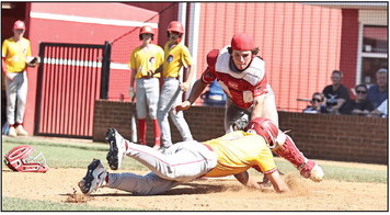 North Rock Creek's Greyson Ratcliff stops the Dale runner for the out at home. It was a clean sweep for Dale as the Cougars lost the varsity game 3-4 and the JV lost 2-8. Photo courtesy of Gowin Photography