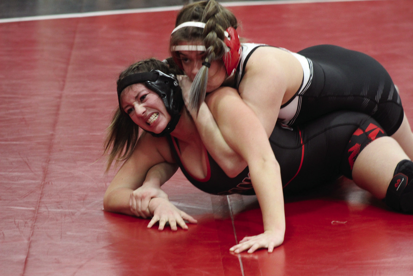 McLoud's Laine Walker gets the best of her Mustang match during the McLoud Redskin Rumble Girls Dual Championship on Jan. 20. McLoud High School hosted 16 teams for the fourth annual event. Broken Arrow was the final winner by criteria, after tying Bixby, 36-36, said McLoud Girls Wrestling Coach William Winters. McLoud was in the consolation bracket, having beaten Union, 51-24, and Mustang, 48-30, but falling to Del City, 30-39. Countywide & Sun/Natasha Dunagan