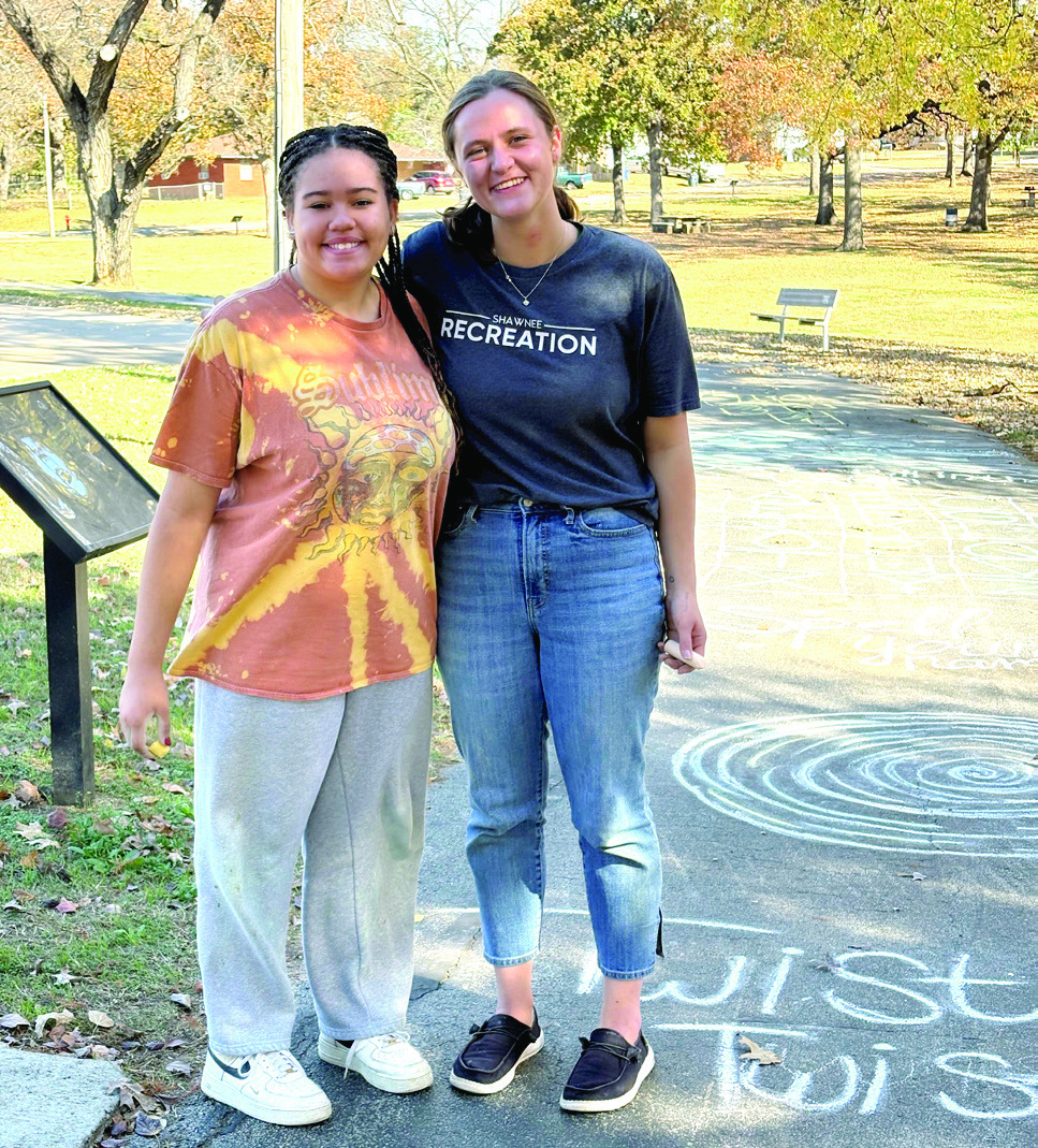 The Fall Youth Volunteer Program completed a sidewalk chalk obstacle course. This project was completed by youth volunteer Savannah Talton (left), who clocked in 28 hours during the fall program and Recreation Aide, Shaylee Crowder. Photo Provided