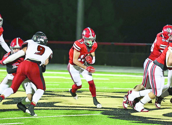 NRC's Reid Rollins finds a big hole for a first down. NRC lost to Plainview 21-18 on Halloween. They will play their last regular season (senior night) game against Anadarko on Nov. 7. Photo Courtesy of Gowin Photography