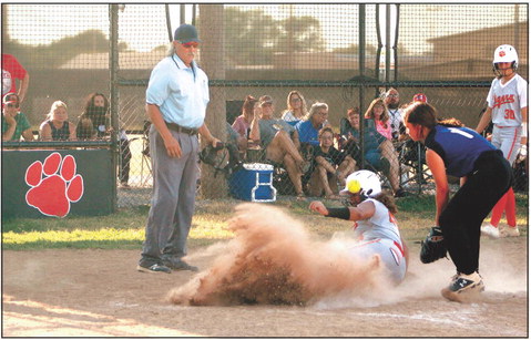 Maud’s Amerikus Street slides into home after stealing second and third, as the Bowlegs pitcher throws the ball to tag her too late. Maud won the home game on Aug. 25, 11-0. Countywide & Sun/Natasha Dunagan