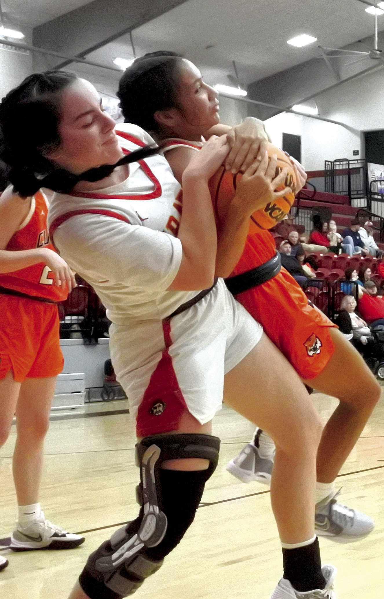 Dale Lady Pirate Karsen Griggs lifts her Cushing opponent off the ground as she tries to rip the ball loose, but ends up with a jump ball during the game Thursday, Dec. 7. The Lady Pirates won the first round game of the Boomarang Classic Tournament, 56-21. Countywide &amp; Sun/Suzie Campbell