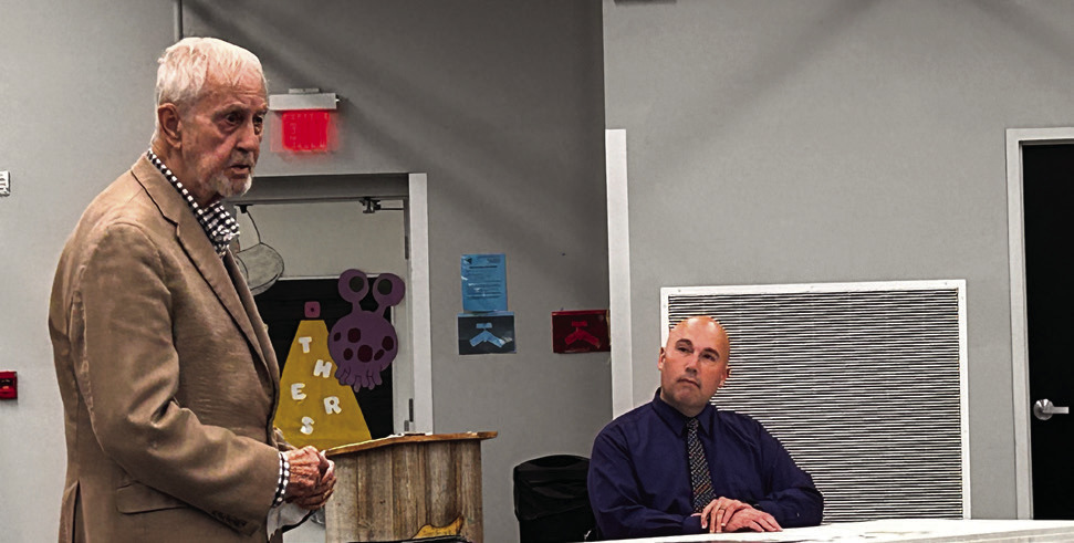 Donald Rominger (left) addresses the board while Superintendent Robert Kinsey listens intently Countywide &amp; Sun/Suzie Campbell