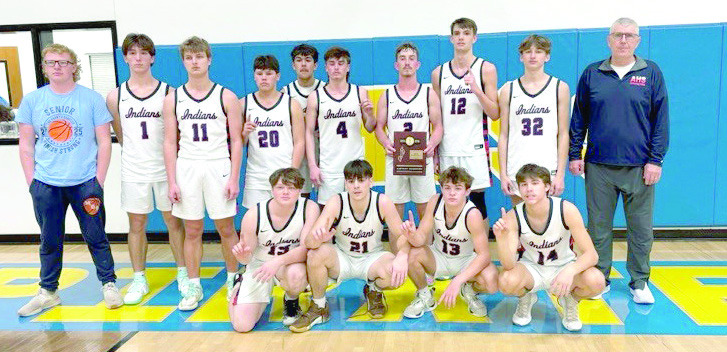 The Asher Indians, coached by Lee Reimer, pose after winning Class B Districts in Moss. They beat Moss on Feb. 15, 38-25, and will begin the regional competition on Feb. 21 at 7:30 pm, also in Moss. So far, their record is 20-3. Photo provided.