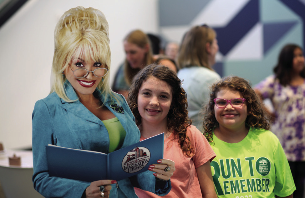 Library customers pose to celebrate Dolly Parton’s Imagination Library. (Photo provided.)