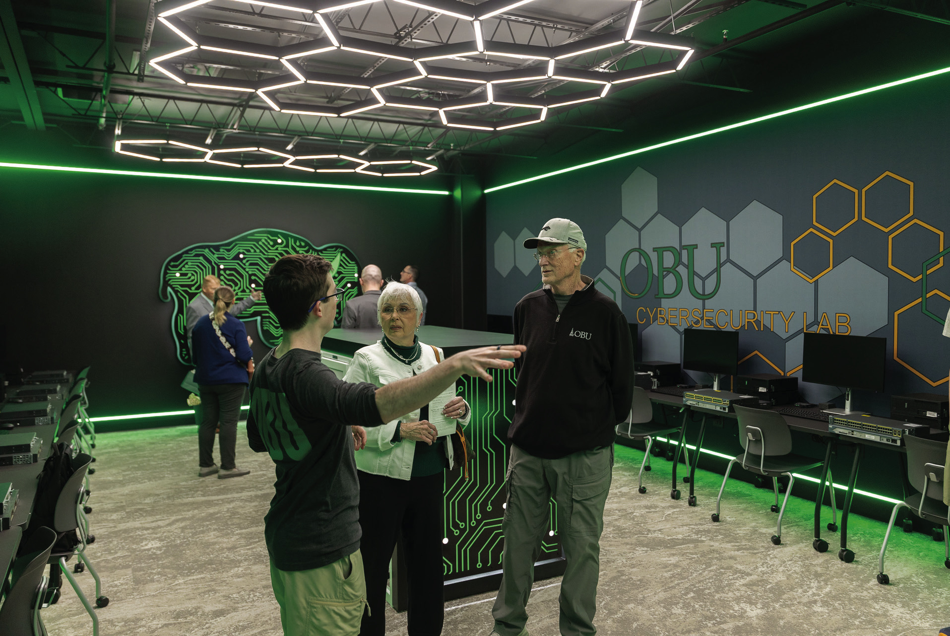 Guests tour the new cybersecurity lab inside Thurmond Hall following the March 6 ribbon-cutting ceremony at Oklahoma Baptist University. The lab features hands-on workstations with servers, routers and switches designed to give students practical experience in cybersecurity systems and network defense. Photo provided by OBU