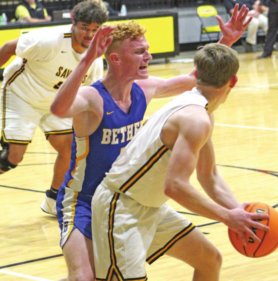 Tecumseh’s Ben Corley looks to pass the ball to his teammate Jay Mitchell as Bethel’s Jace Stewart plays defense. Countywide &amp; Sun/ Natasha Dunagan