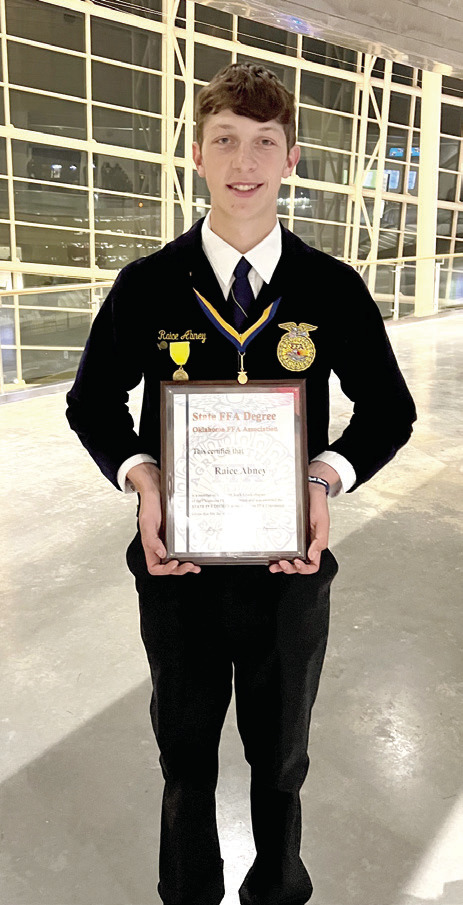 North Rock Creek graduate Raice Abney recently received his American FFA Degree. He is shown holding his State FFA Degree, which is a prerequisite, in 2024. Photo provided