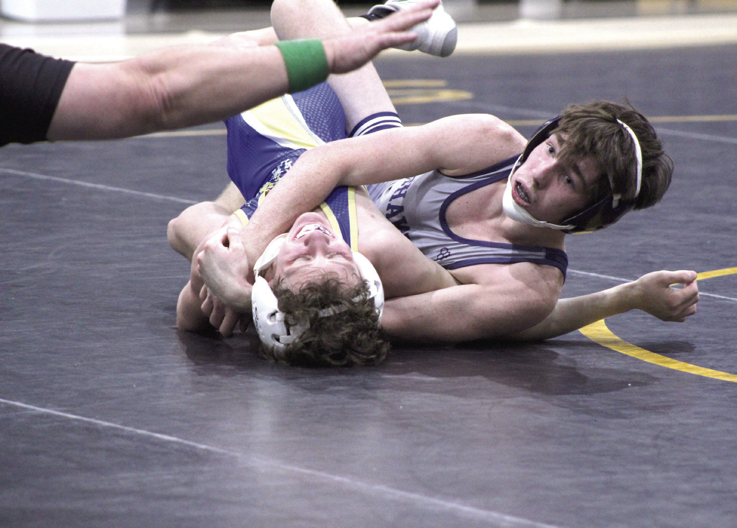 Shawnee’s Blayne Taber gets confirmation from the referee of the pin of his Noble opponent during the dual meet on Jan. 25, held at the PAAC. File photo