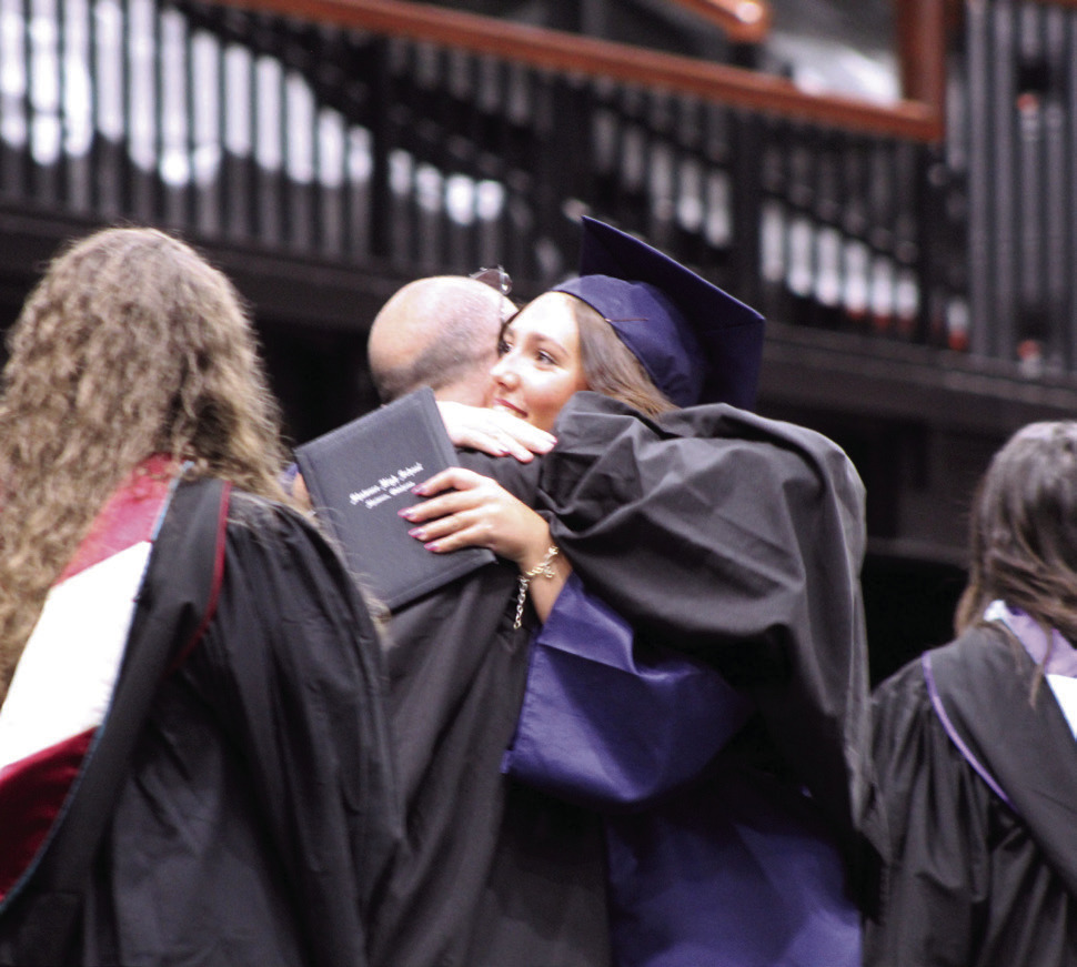 Alivia Cook gets a hug from her father, Shawnee High School Principal Bobby Cook. Natasha Dunagan, Countywide &amp; Sun