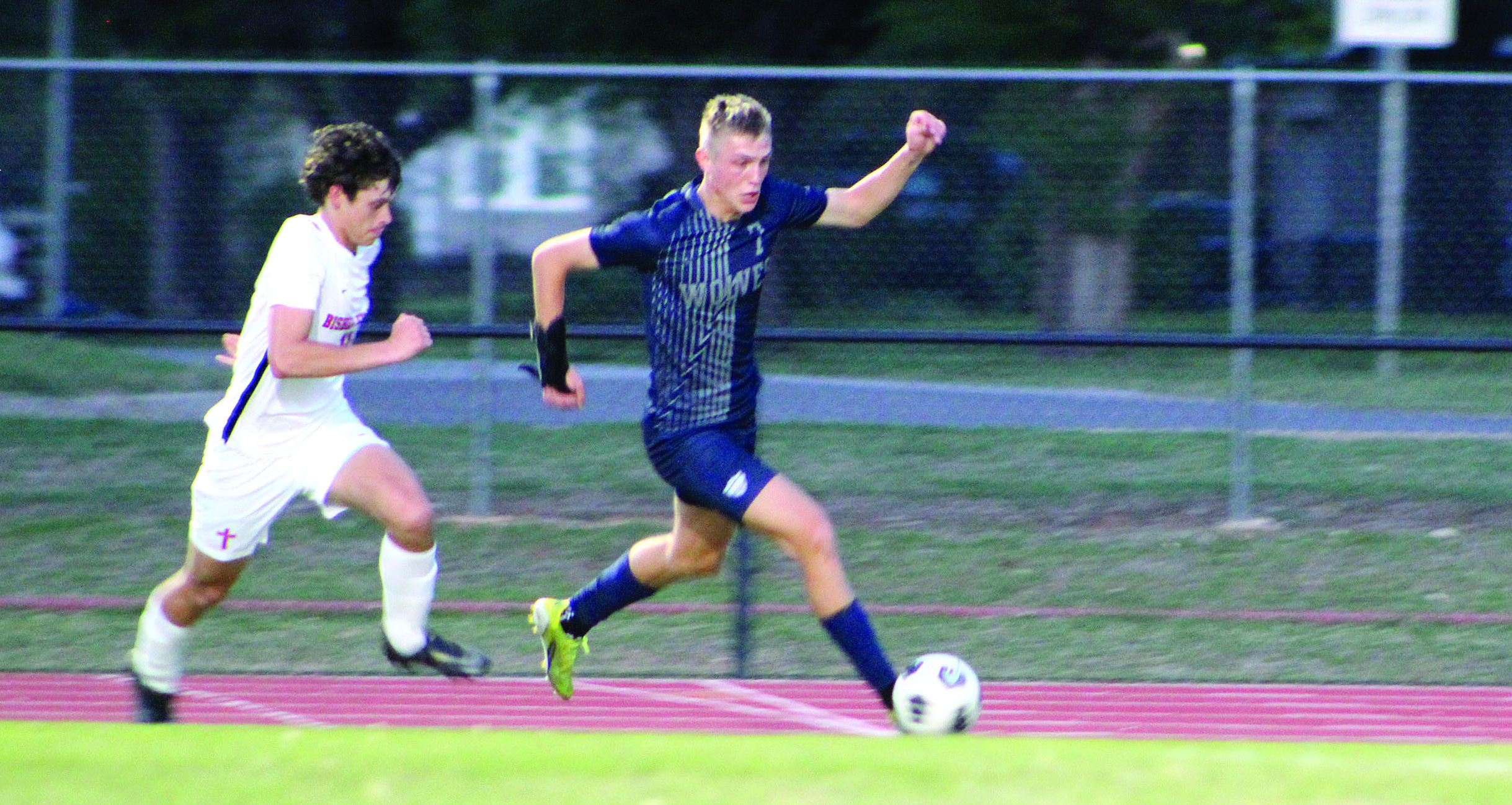 Shawnee’s Camden Sateren drives toward the goal during the home game against Bishop Kelley on April 14. The Wolves lost, 0-5. Countywide &amp; Sun/Natasha Dunagan