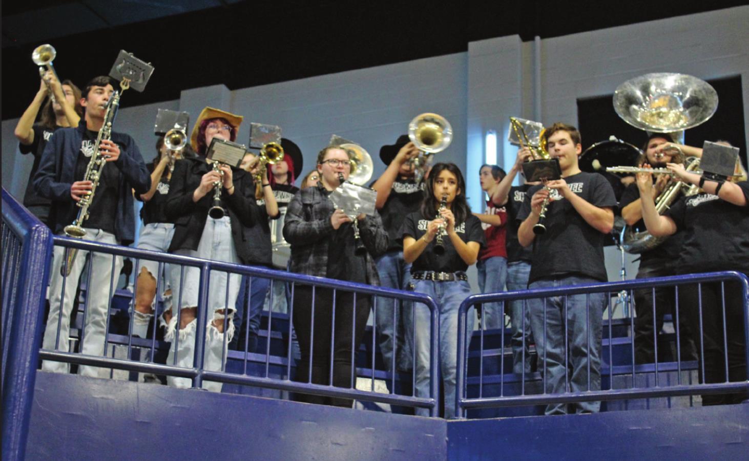 Members of the Shawnee High School Pride of the Pack band play during halftime of the girls game against Tecumseh on Jan. 14.