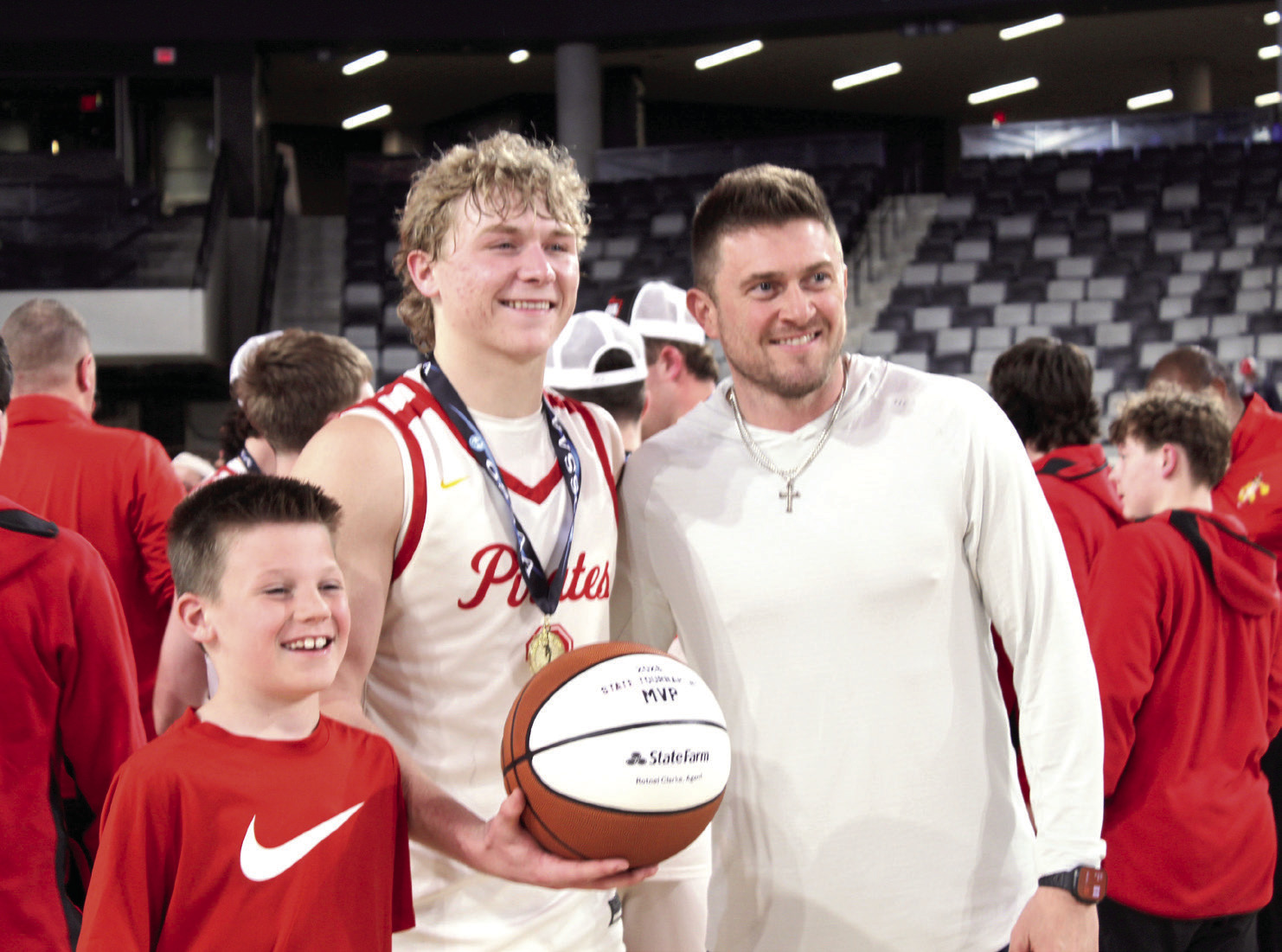 Dale senior Denton Forsythe receives the 2026 State Tournament MVP game ball from Rotnei Clarke, a State Farm Insurance Agent and former Verdigris High School and University of Arkansas basketball player, following the 2A State Championship victory at the OG&amp;E Coliseum in OKC on March 14. Natasha Dunagan, Countywide &amp; Sun