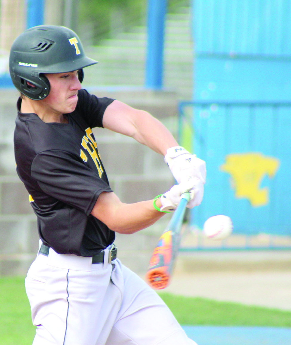 Tecumseh junior Elias Hasler smacks the ball for a single during the double header at Bethel on April 17. The Savages won both games 3-12 and 1-12. Natasha Dunagan, Countywide & Sun
