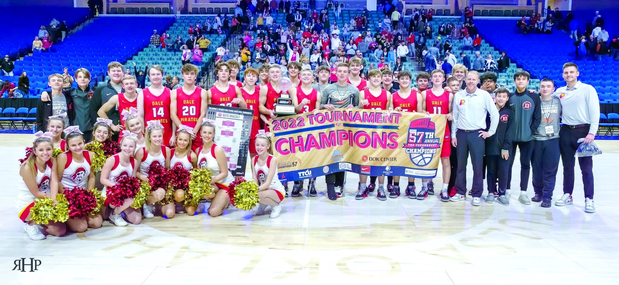The Class 2A Dale Pirates basketball team, their coaches and the Dale cheerleaders pose after winning the 2022 Tournament of Champions in Tulsa on Dec. 30. They are the first small school to win the tournament since 1978. The team returned to defend their title in the 58th TOC on Dec. 27, 2023. Photo provided.