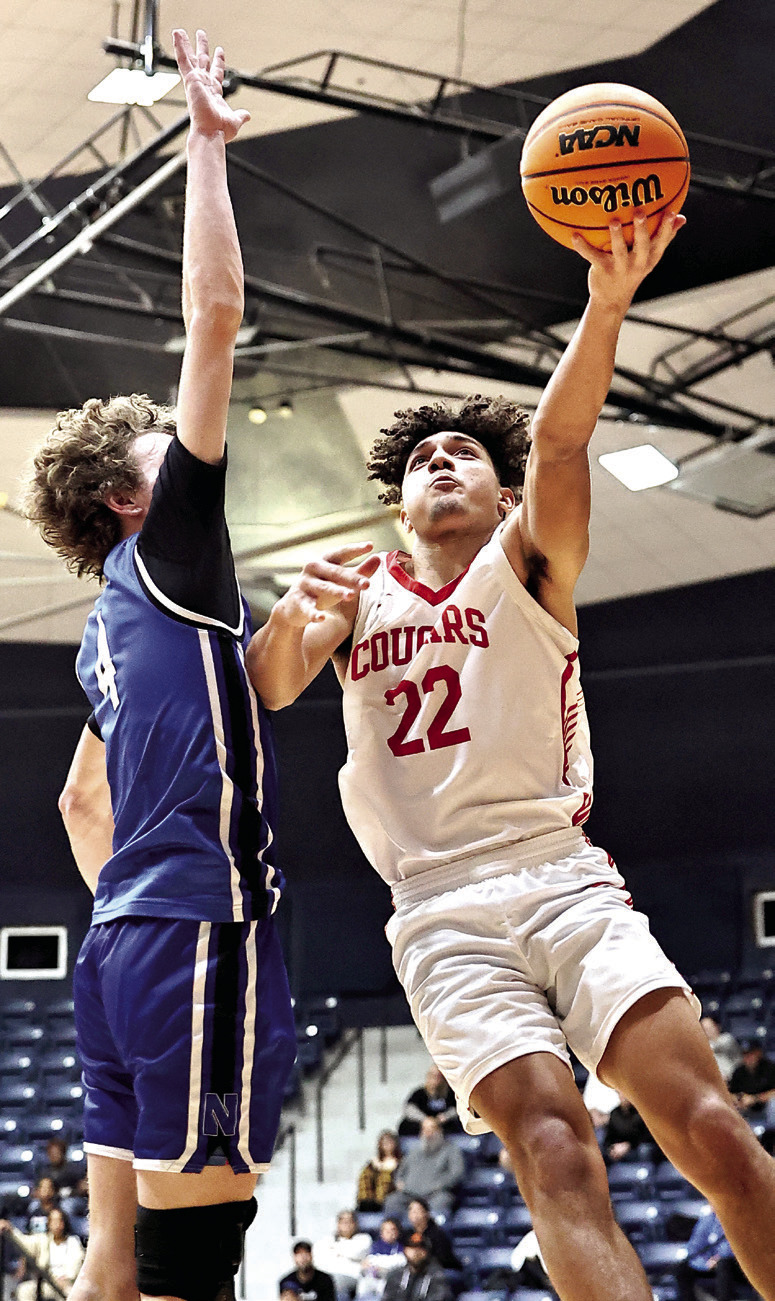 North Rock Creek’s Caleb Hawkins goes up for a shot in Area play last week. NRC punched their ticket to the State Championship beating Newcastle 62-57