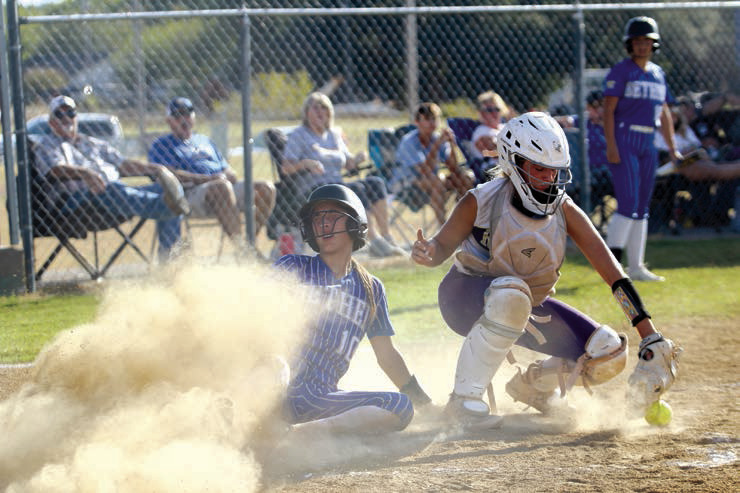 Bethel junior Layla Menhusen slides into home base after hitting a homerun during a double header home game with Community Christian School on Sept. 19. The Lady Wildcats won both games: 8-4 and 8-3. Countywide & Sun/Natasha Dunagan 