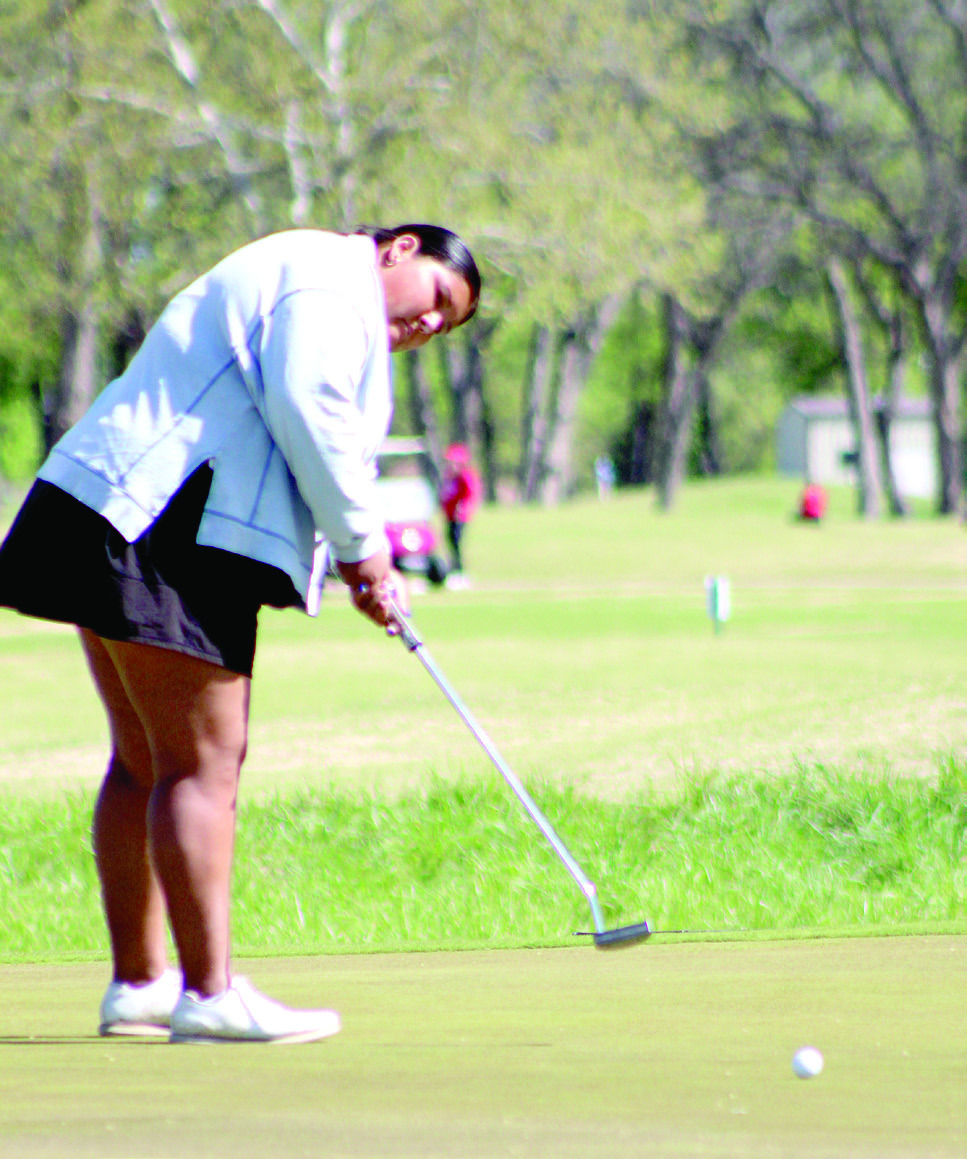 Shawnee senior Kanynn Kaseca putts at the 10th hole during the Tecumseh Girls Golf Tournament, held at FireLake Golf Course on April 15. Tecumseh and North Rock Creek golfers also participated. Natasha Dunagan, Countywide & Sun
