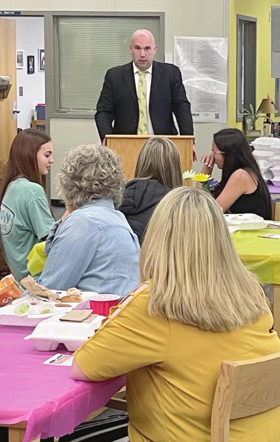 Tecumseh Superintendent Robert Kinsey opens the luncheon with high school students interested in a teaching career. Photo provided
