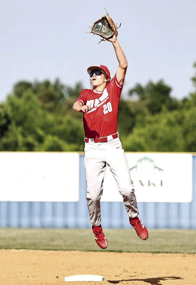 North Rock Creek’s Hunter Bertram leaps for the ball in action June 11 against Bethel in the summer league game.